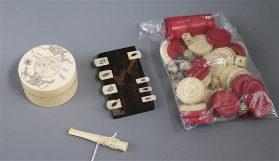 A Japanese ivory box, a cheroot holder, draughts counters and dice shakers etc., all early 19th/early 20th century